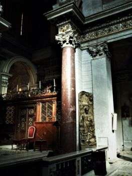 Photo of Classical red-porphyry column in the San Crisogno Church in Rome.